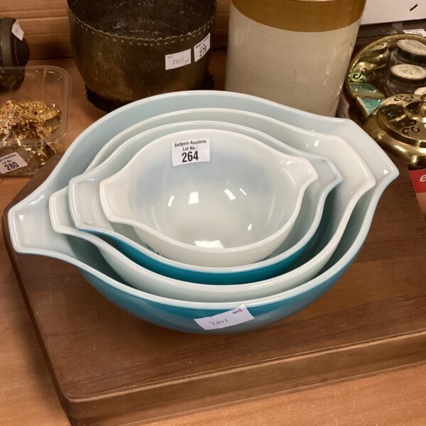 Set of five vintage Pyrex mixing bowls in graduated sizes.