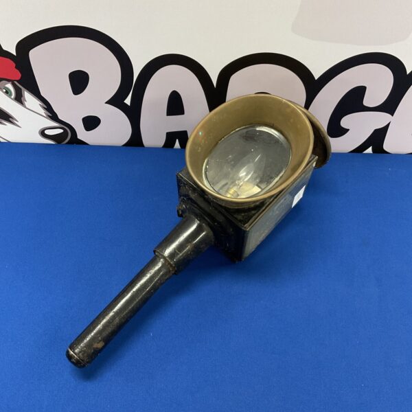 Antique brass vintage carriage lantern with clear glass lens.