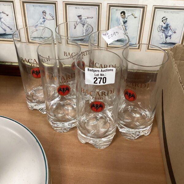 Close-up of vintage Bacardi glasses with auction lot number 270.