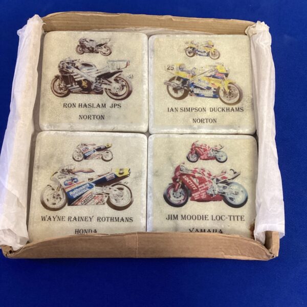 Set of four vintage motor cycle racing marble coasters.