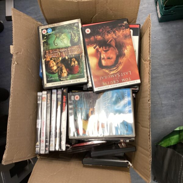 Large lot of DVD and Blu-Ray discs for home entertainment.