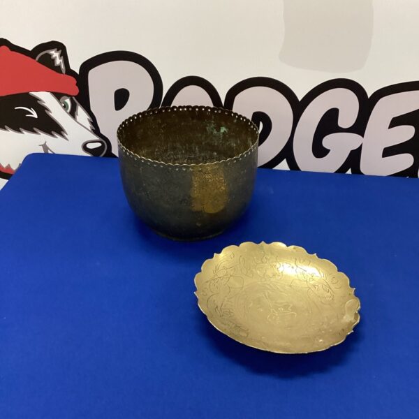 Vintage engraved copper bowl with intricate detailing.
