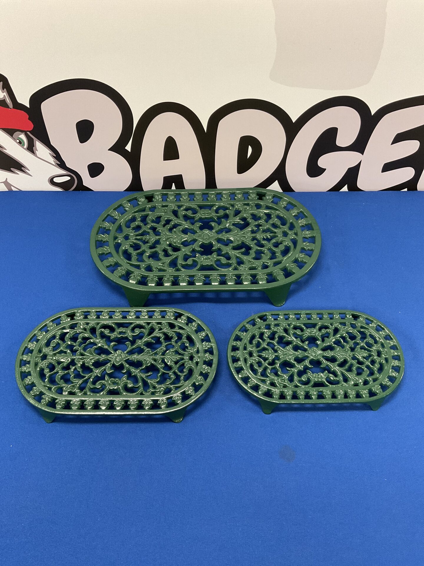 033 Three cast iron pot trivets