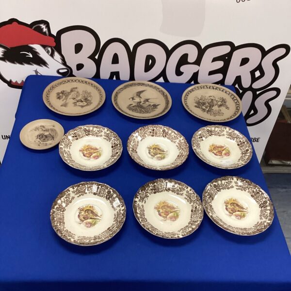 Set of vintage Royal Worcester game plates with bird illustrations.