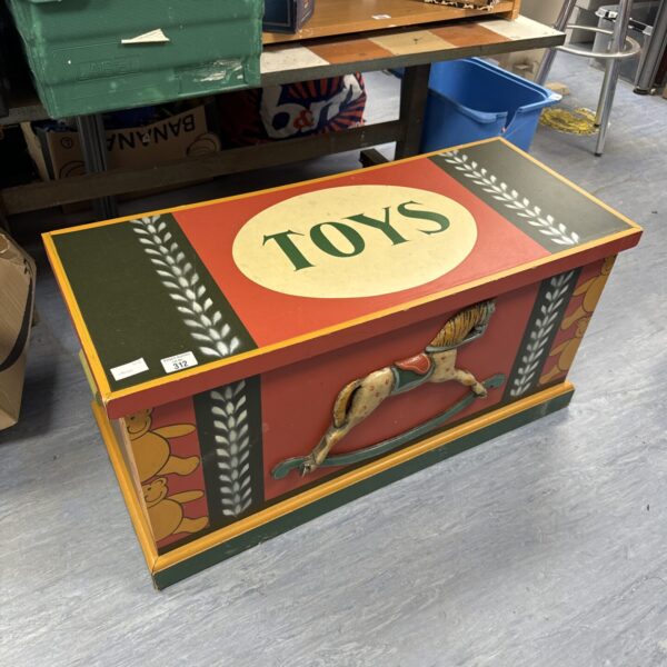 Colourful vintage Hamleys toy chest with painted details.