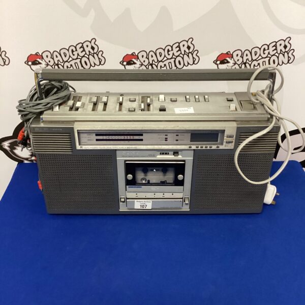 Vintage Sony boombox with cassette player and radio tuner.