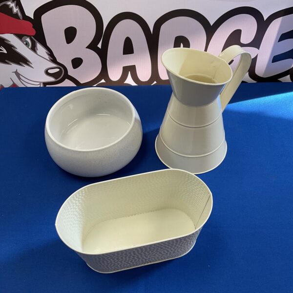 Vintage metal jug and trough planter with ceramic bowl.