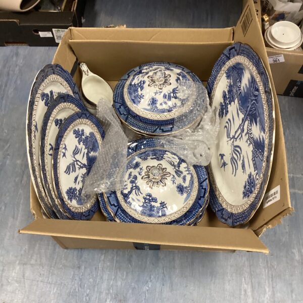 Vintage Willow Pattern china collection on display.