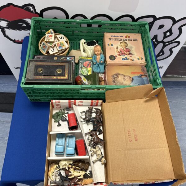 Vintage toy lot with diecast vehicles and tin toys.