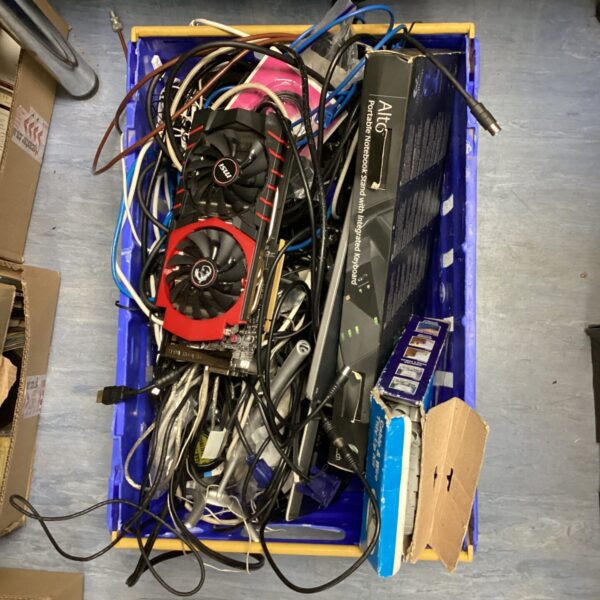 Assorted electronics and cables in a mixed lot for repair or collection.