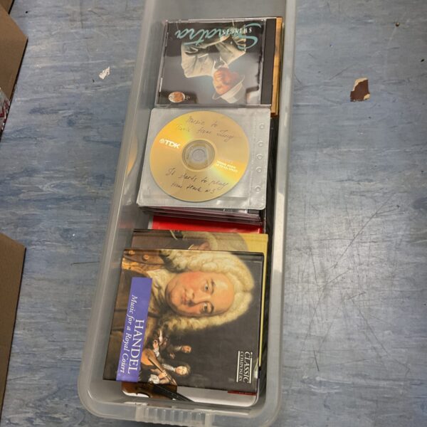 Mixed genre CD collection with various artists and album covers.