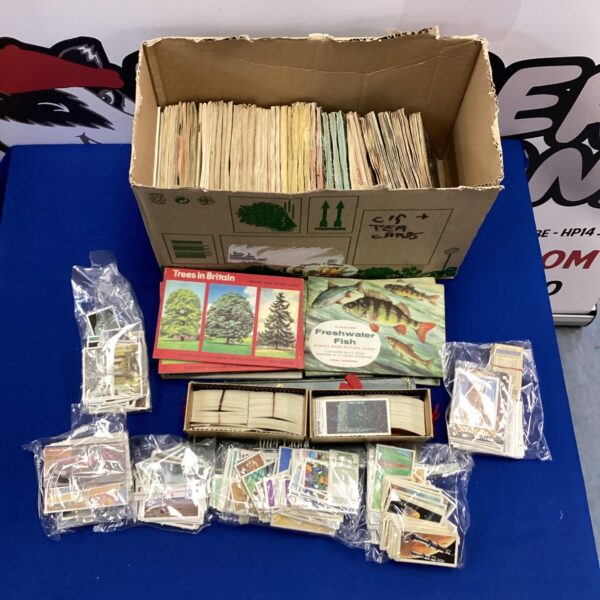 Vintage cigarette card collection with albums for storage.