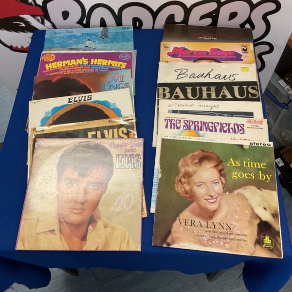 Vintage vinyl records collection featuring Elvis Presley and Vera Lynn.