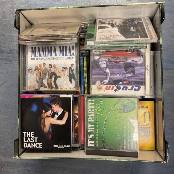 Collection of music CDs in a pirate-themed box.