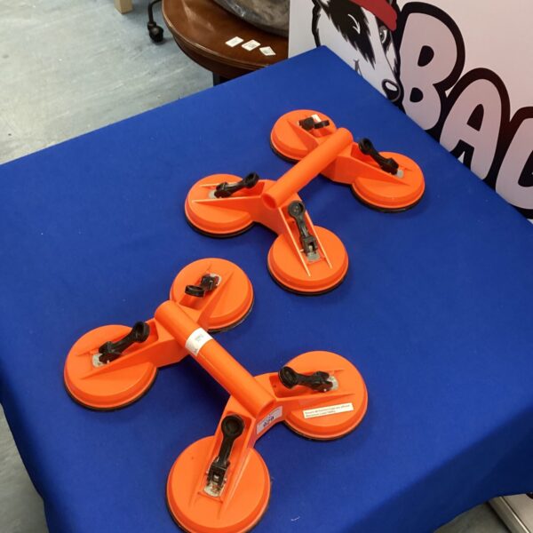 Pair of glass carrier suction grips for safe lifting.