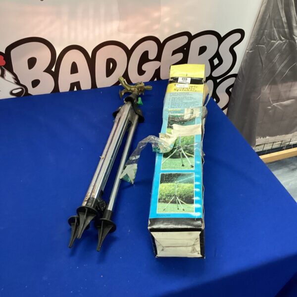 Telescopic garden sprinkler with adjustable height for lawn watering.