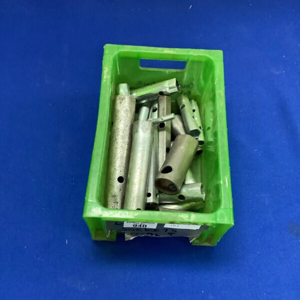 Vintage set of tubular spanners in a green tray.