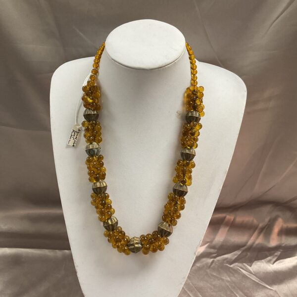 Vintage amber bead necklace with faceted yellow beads.