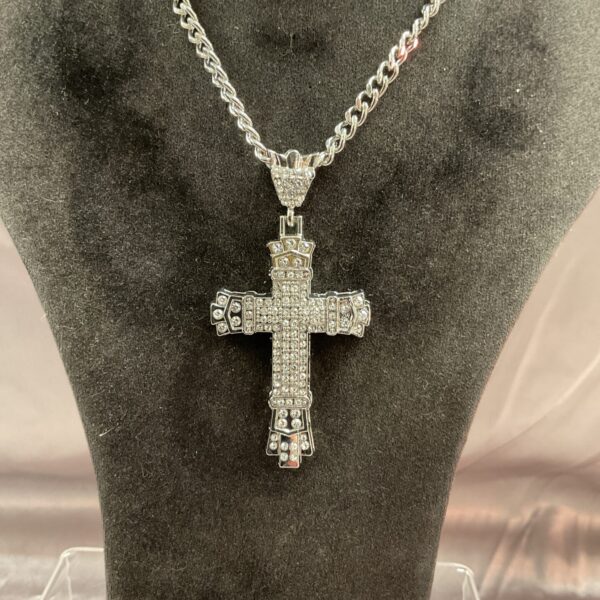 Sparkling silver tone diamante crucifix necklace on a chain.