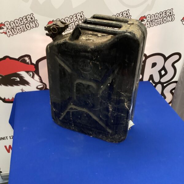 Vintage metal fuel can, showing signs of wear and corrosion.
