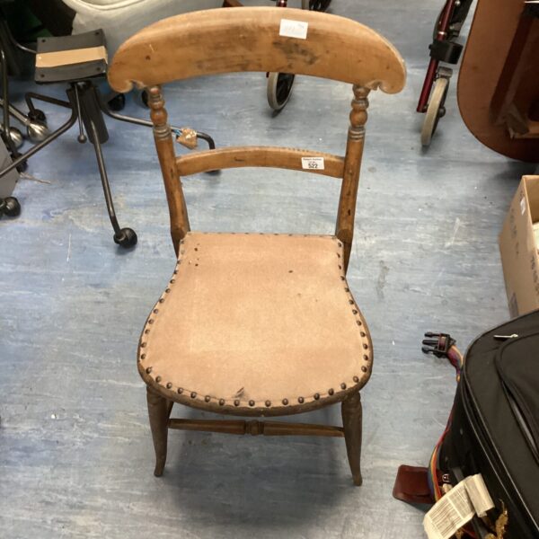 Vintage hall chair with upholstered seat and wooden frame.