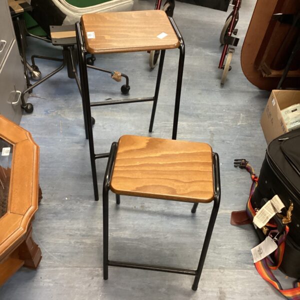 Lot of two vintage wooden stools with black metal frames.