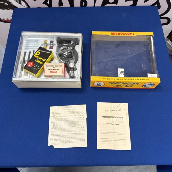 Vintage Merit microscope kit with prepared slides.