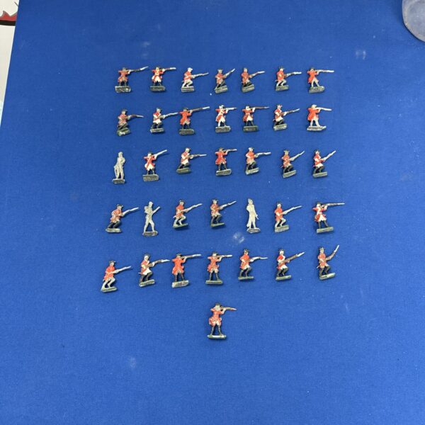 Vintage lead toy soldiers in a collectible lot.
