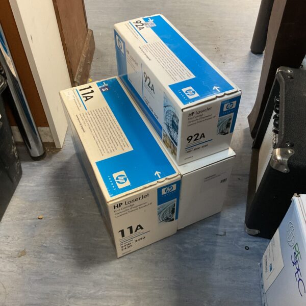 Sealed HP laser printer cartridges, including 92A and 11A models.