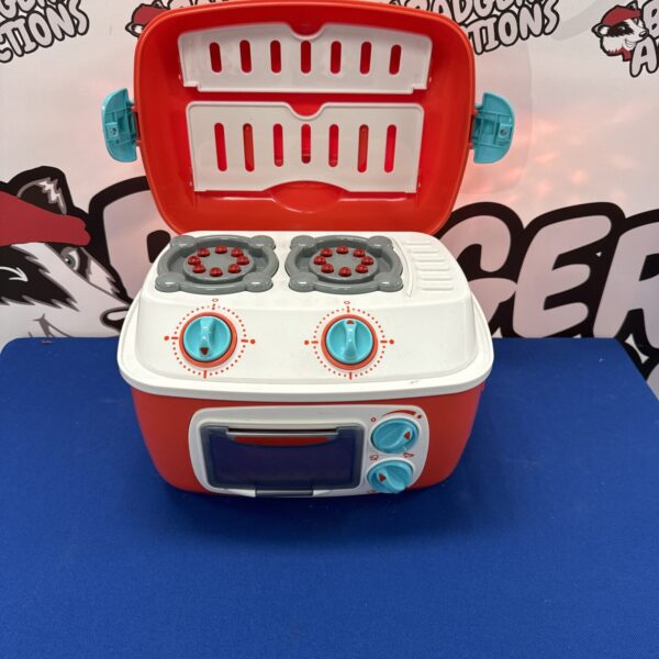 Bright children’s cooker toy for imaginative play.