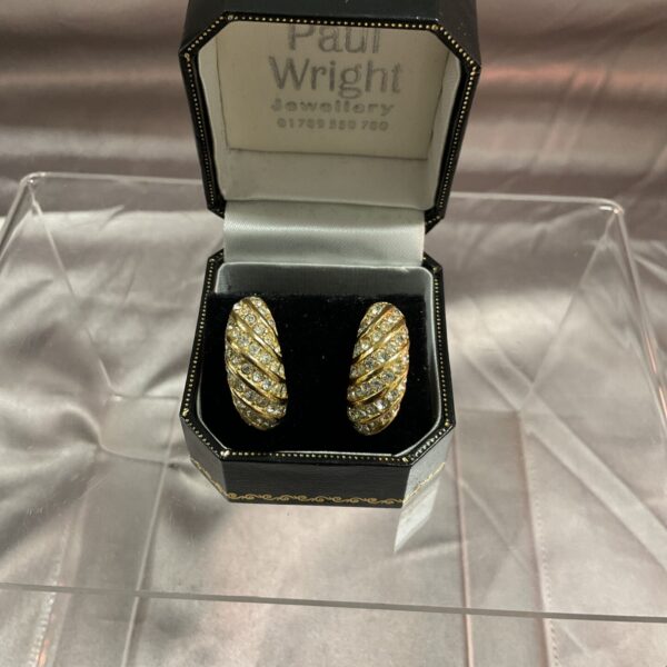 Sparkling vintage diamante clip-on earrings in gold tone.