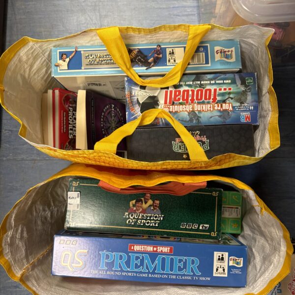 Mixed lot of vintage games and books for family entertainment.