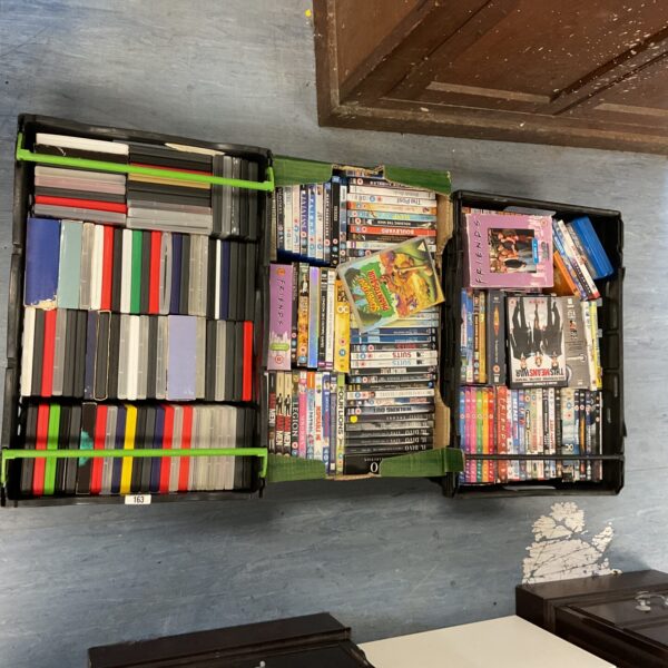 Assorted DVD and Blu-Ray discs in three storage boxes.