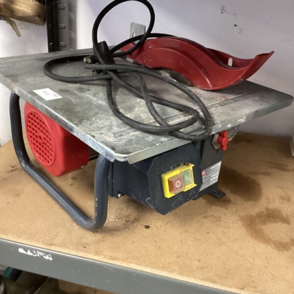 Front view of a used Performance Table Saw with blade guard.