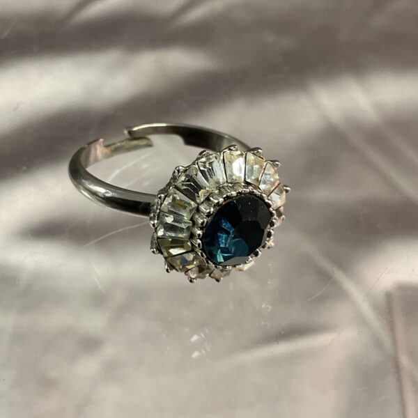 Close-up of a vintage whitemetal sapphire ring, size O.