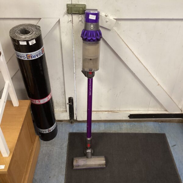 Purple Dyson v10 Animal cordless vacuum cleaner on display.