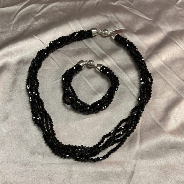 Elegant black spinell necklace and bracelet set in silver tone.
