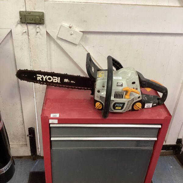 Ryobi 16 inch petrol chainsaw on a workbench.
