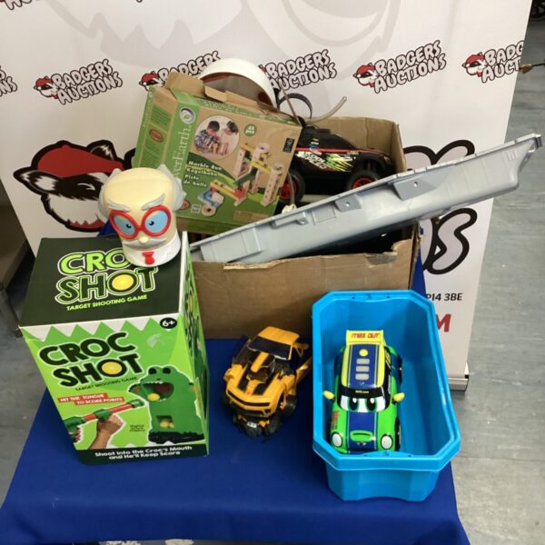 Kids toy bundle featuring Croc Shot game and Transformers figures.
