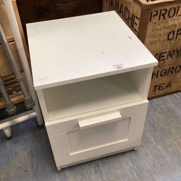 White bedside cabinet with drawer and open shelf for bedroom storage.