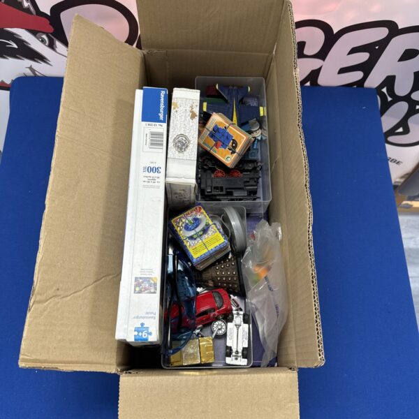 Mixed toy lot with vintage diecast vehicles and action figures.