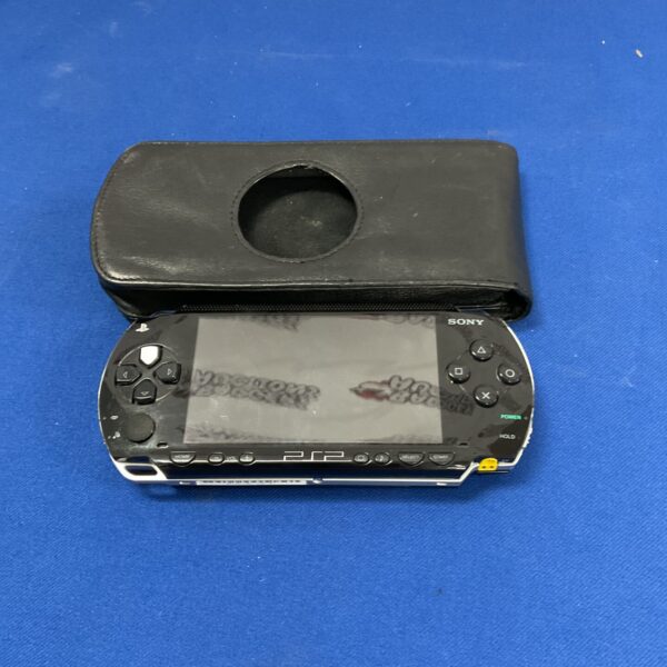 Sony PSP handheld console with protective case for retro gaming.