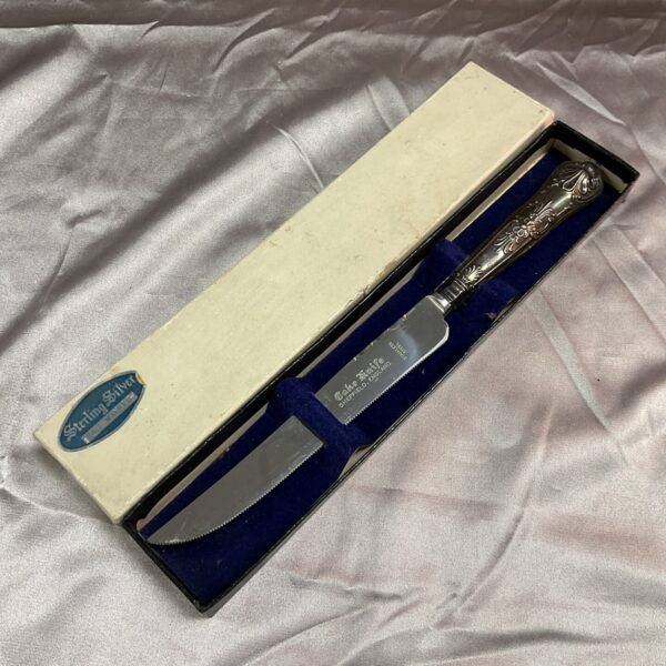 Vintage sterling silver cake knife in its original presentation box.
