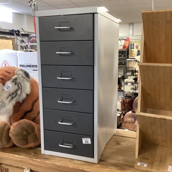 Grey metal filing cabinet with six drawers for office storage.