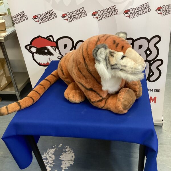 Large cuddly tiger toy, soft plush animal for children.