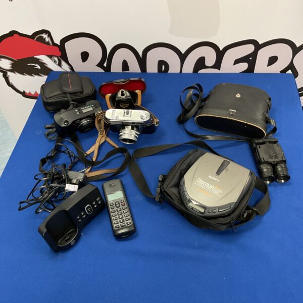 Vintage camera collection with binoculars and portable CD player.