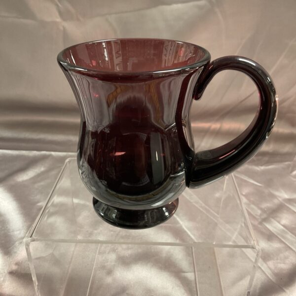 Antique Thomas Webb cranberry glass tankard with a rich red hue.