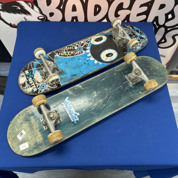 Used skateboards lot featuring Voltage and Monster brands.