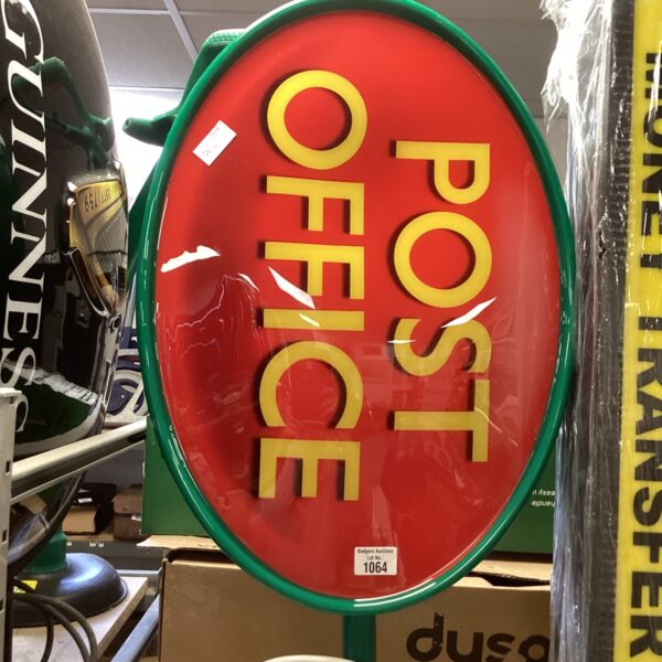 Vintage red and white Post Office enamel sign, retro advertising.