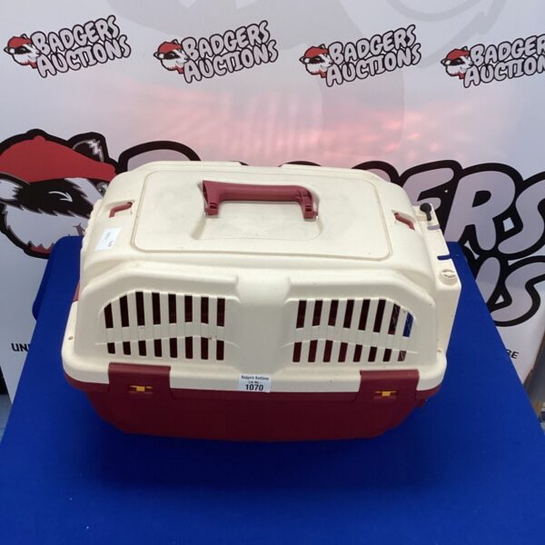 Plastic cat carry box for pet transportation.